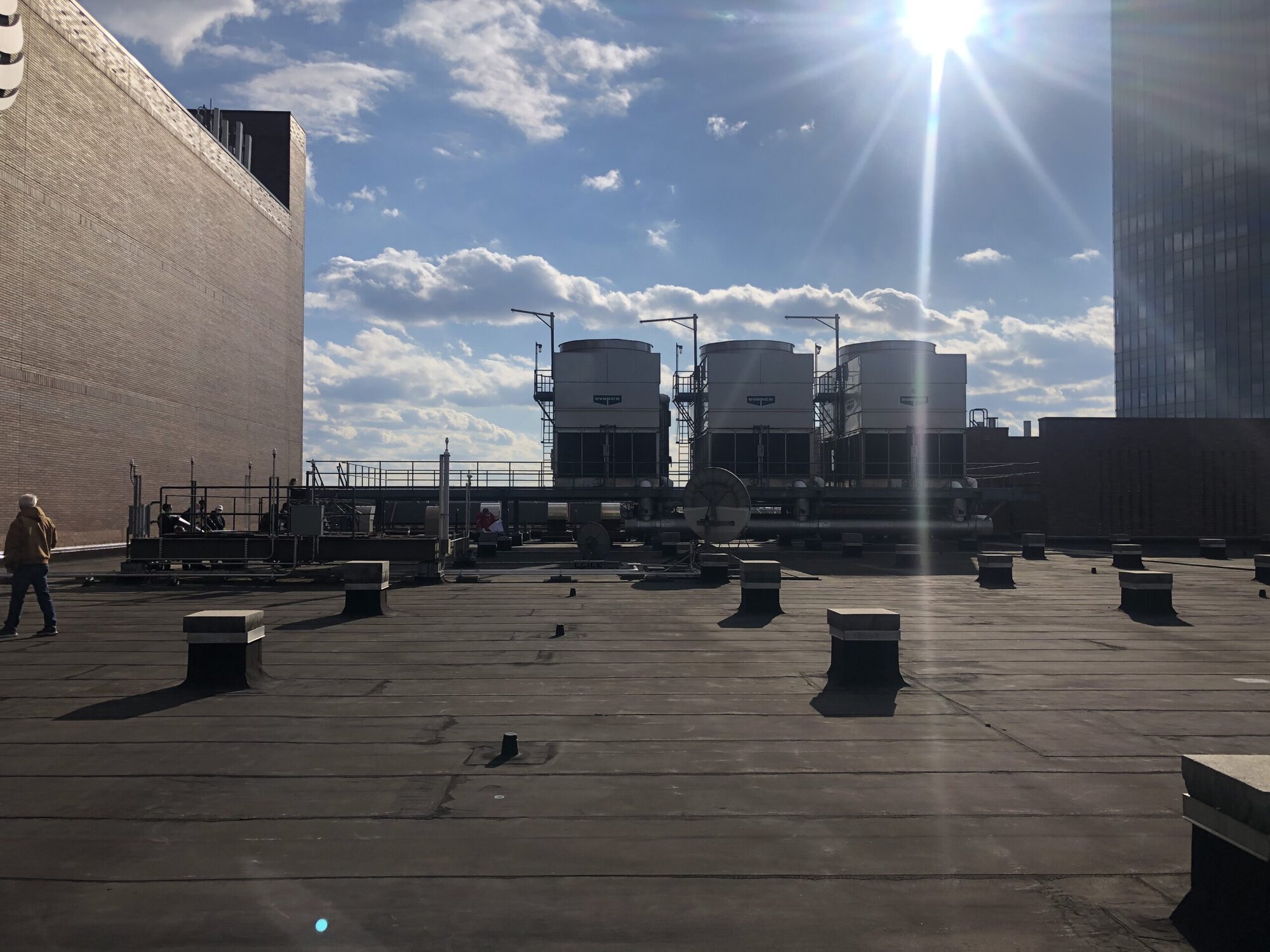 a building with a few white containers on a roof