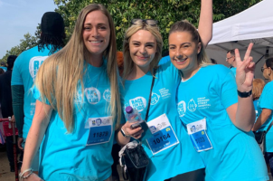 a group of women wearing matching shirts