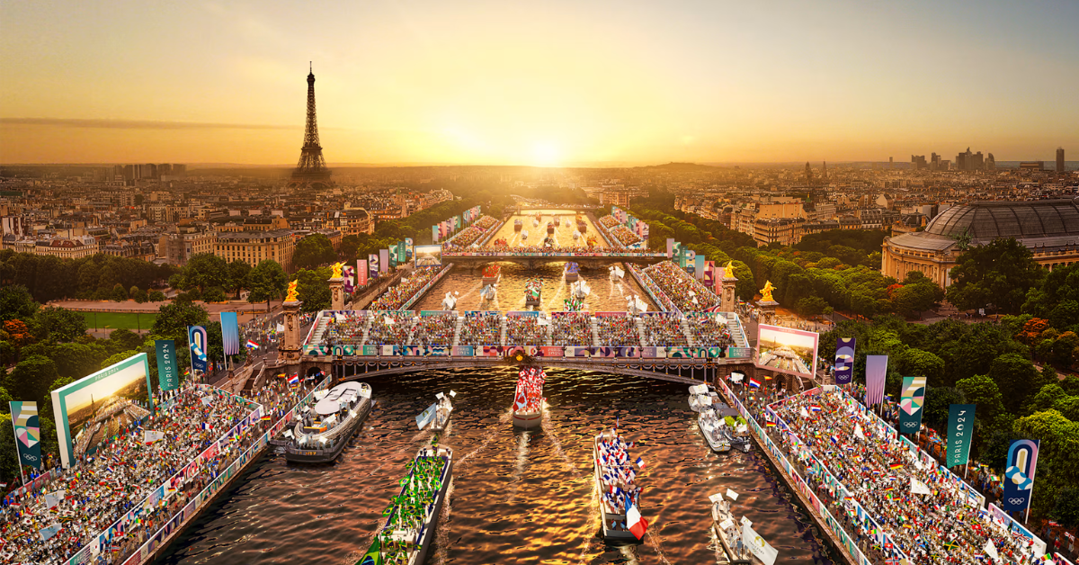 a large crowd of people on boats in a river