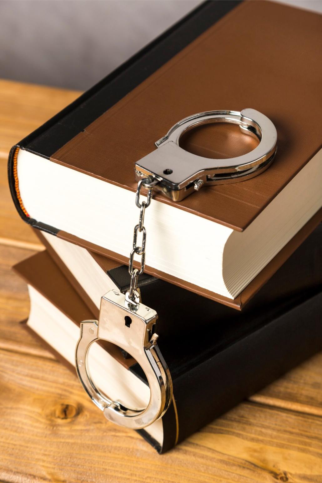 a book with handcuffs on top