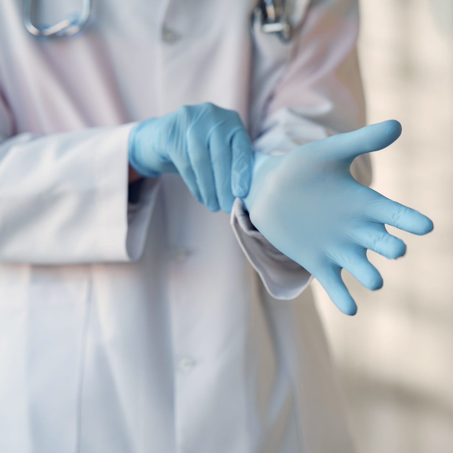 a doctor wearing blue gloves