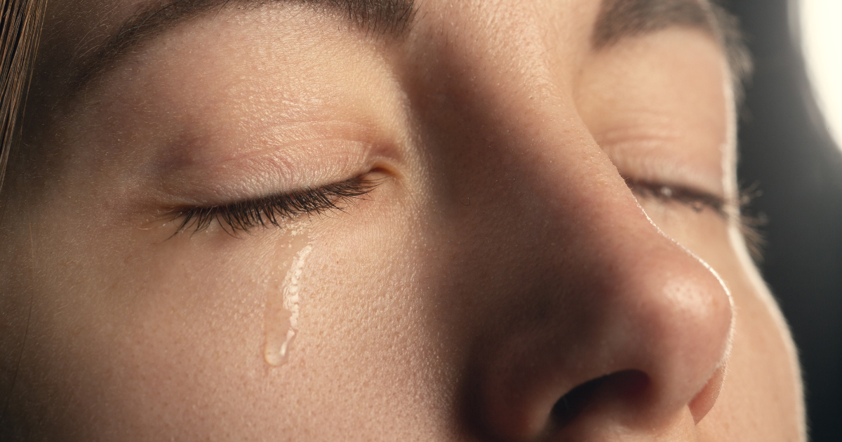 a close up of a crying woman