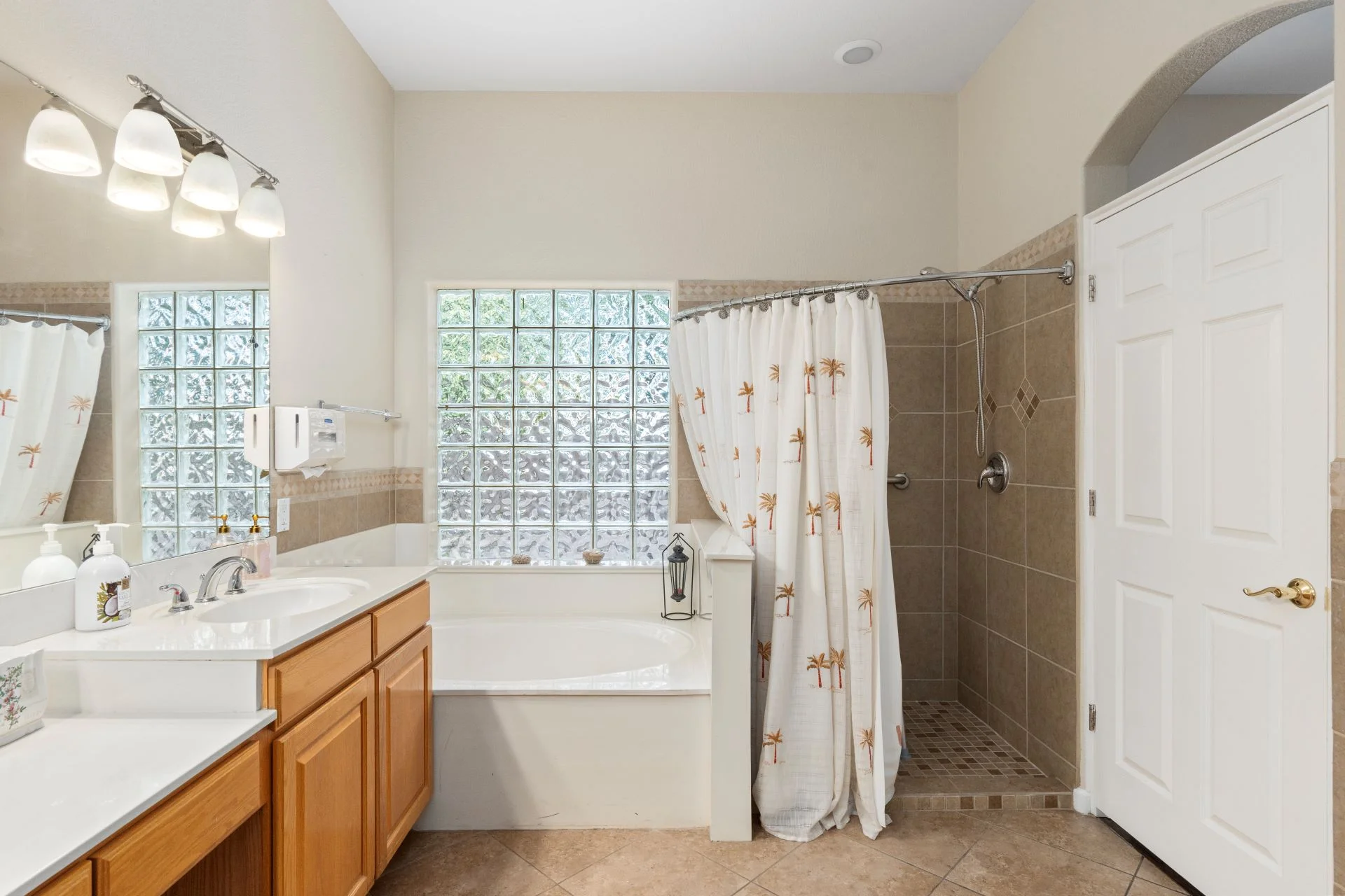 a bathroom with a shower and tub