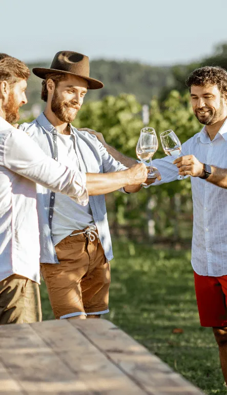 a group of men holding wine glasses