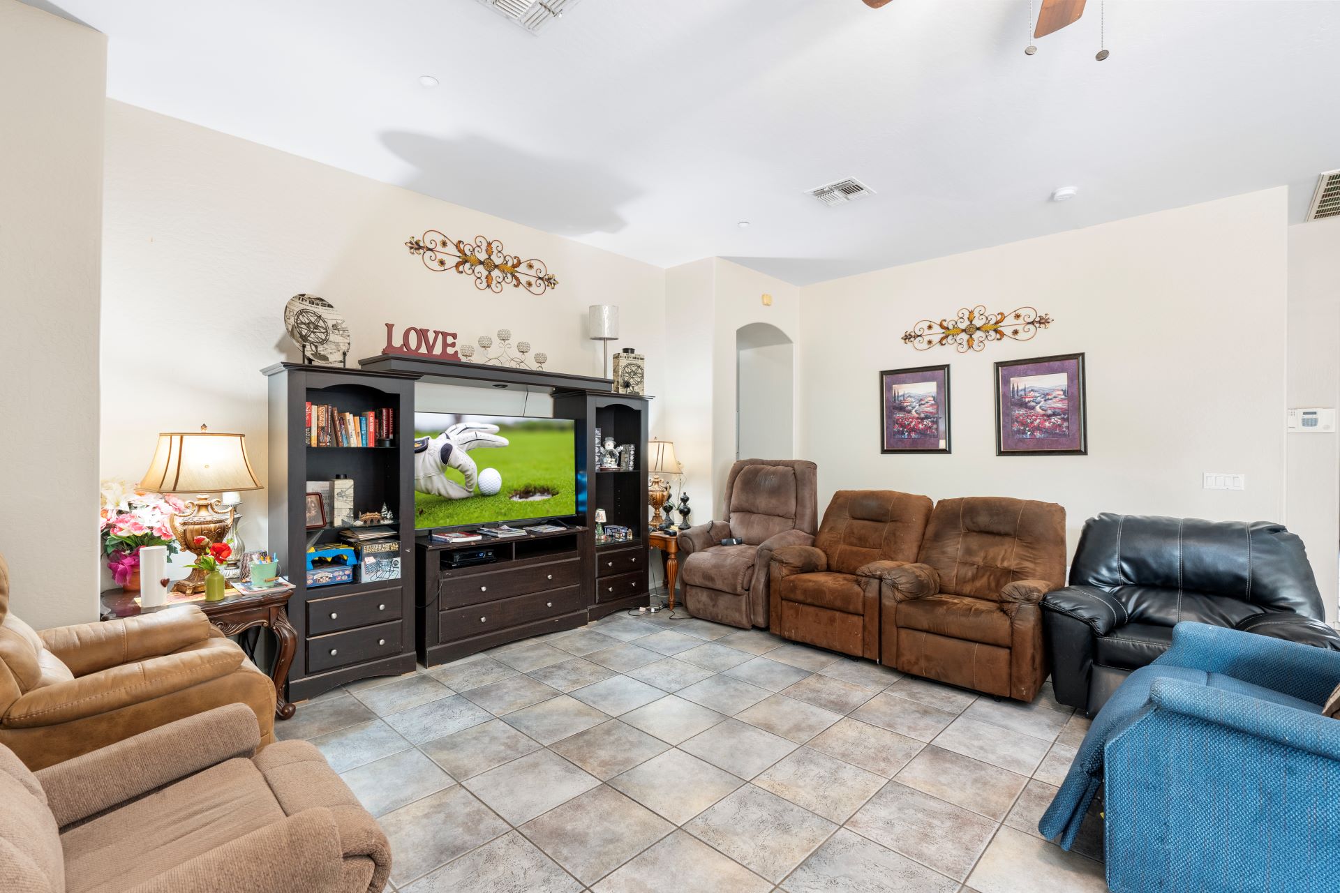 a living room with a television and couches