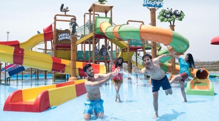 a group of people in a water park