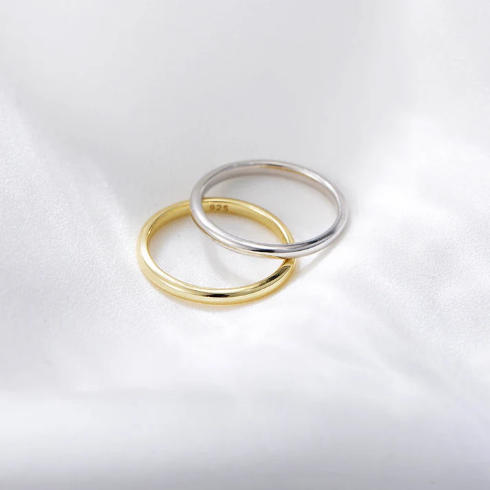 a pair of gold and silver rings