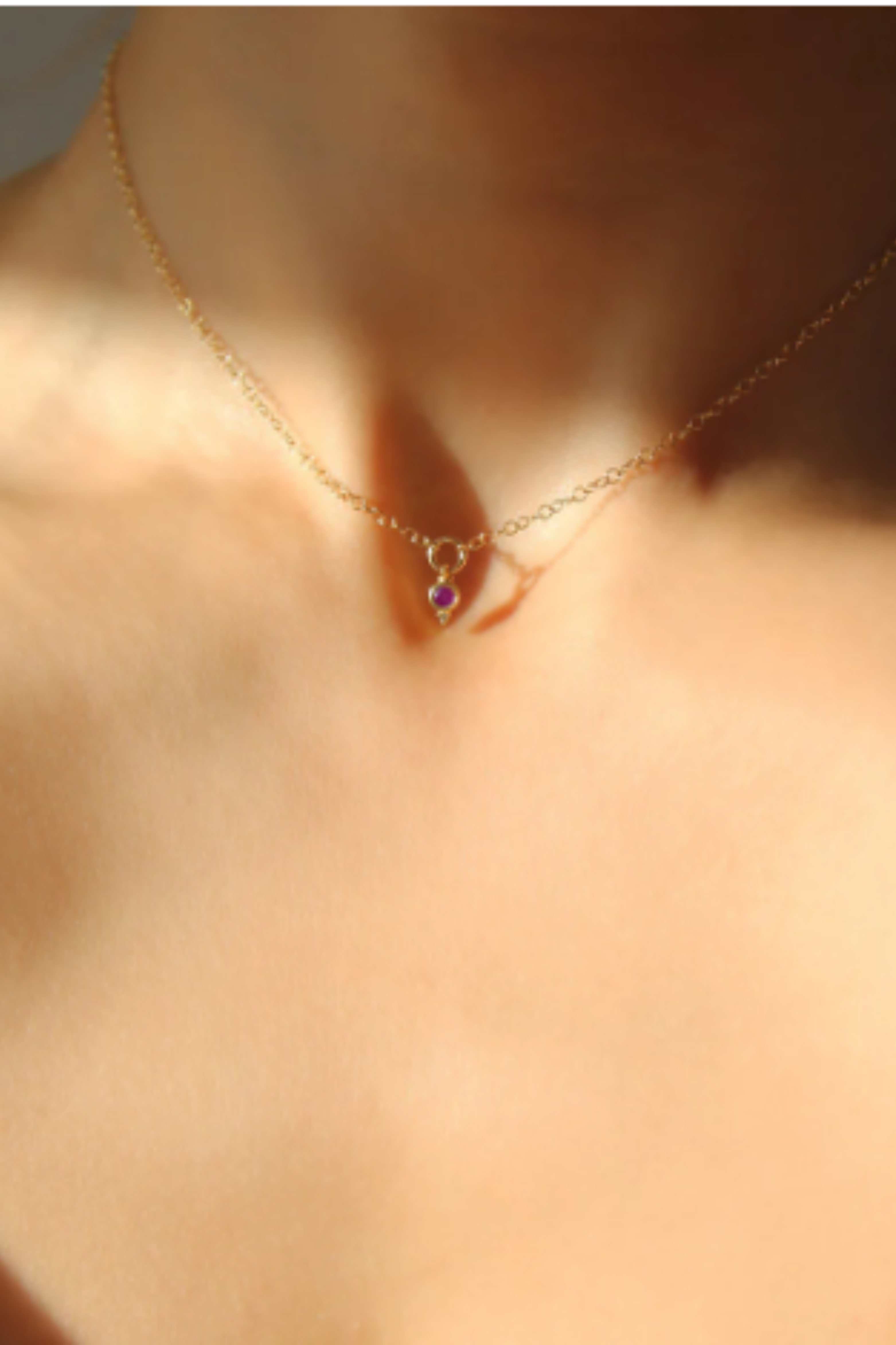 a necklace on a woman's neck