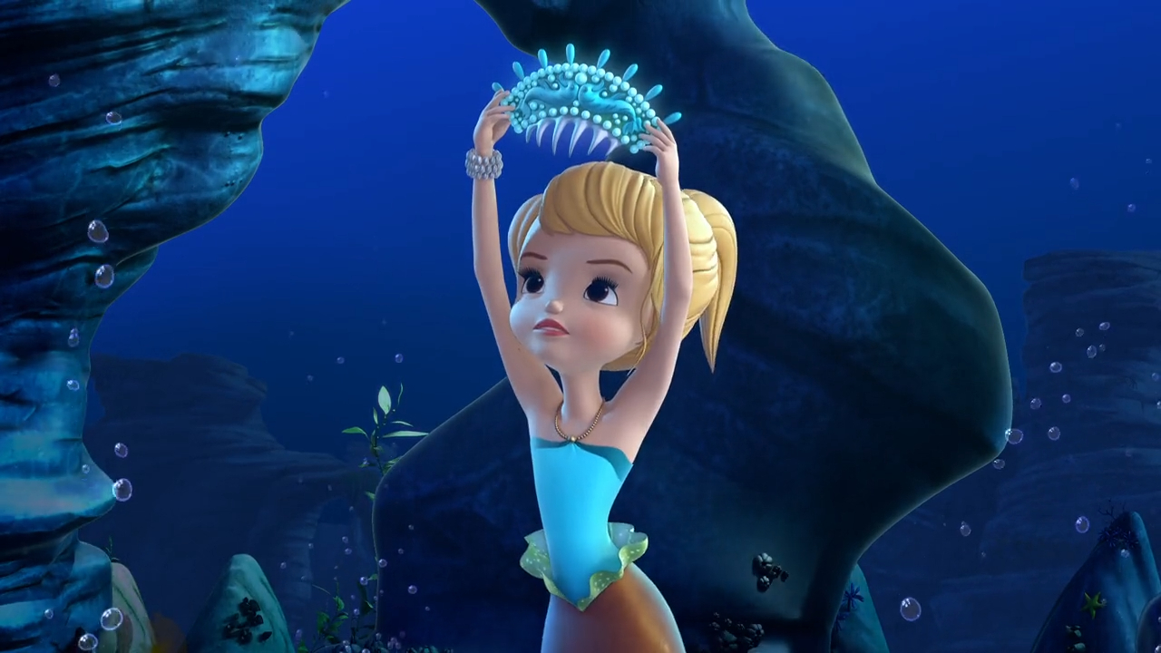a cartoon of a mermaid holding a crown