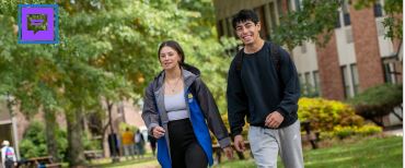 a man and woman walking down a sidewalk