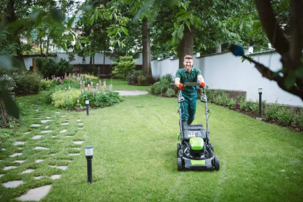 a man mowing the lawn