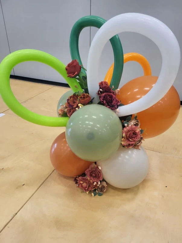 a bunch of balloons with flowers