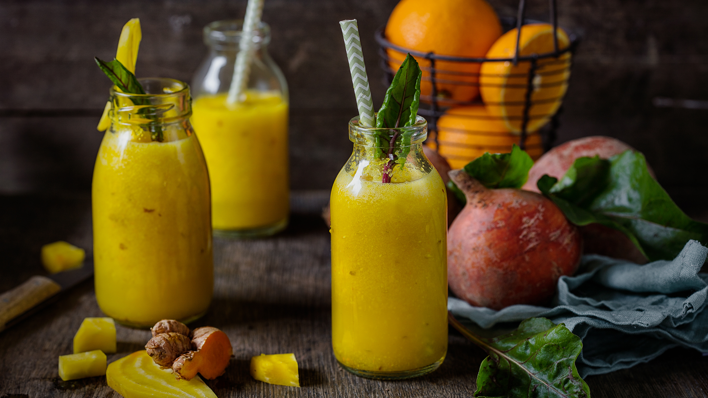 a yellow smoothie in a glass jar