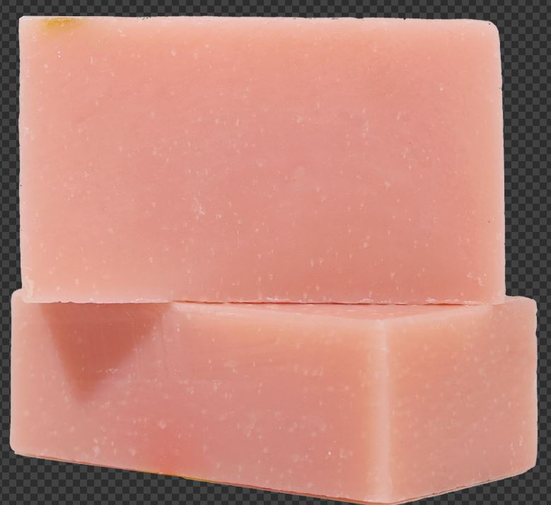 a pink soap on a black background