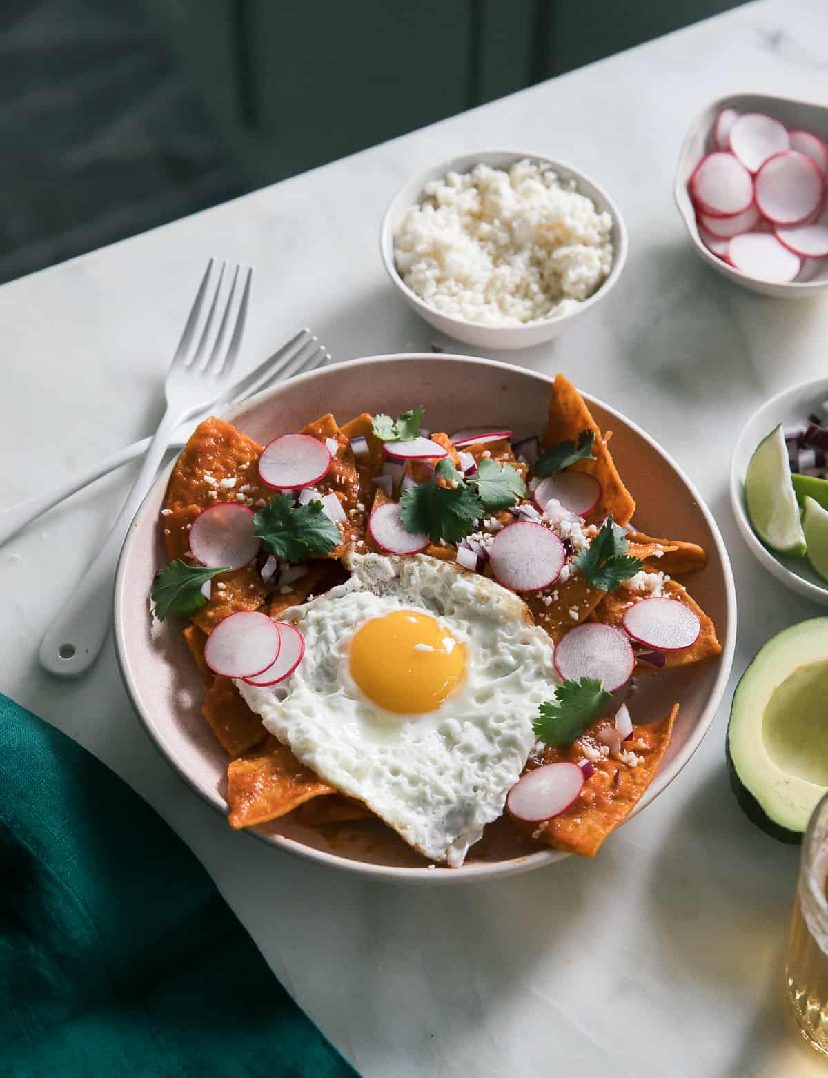 a plate of food with a fried egg and vegetables