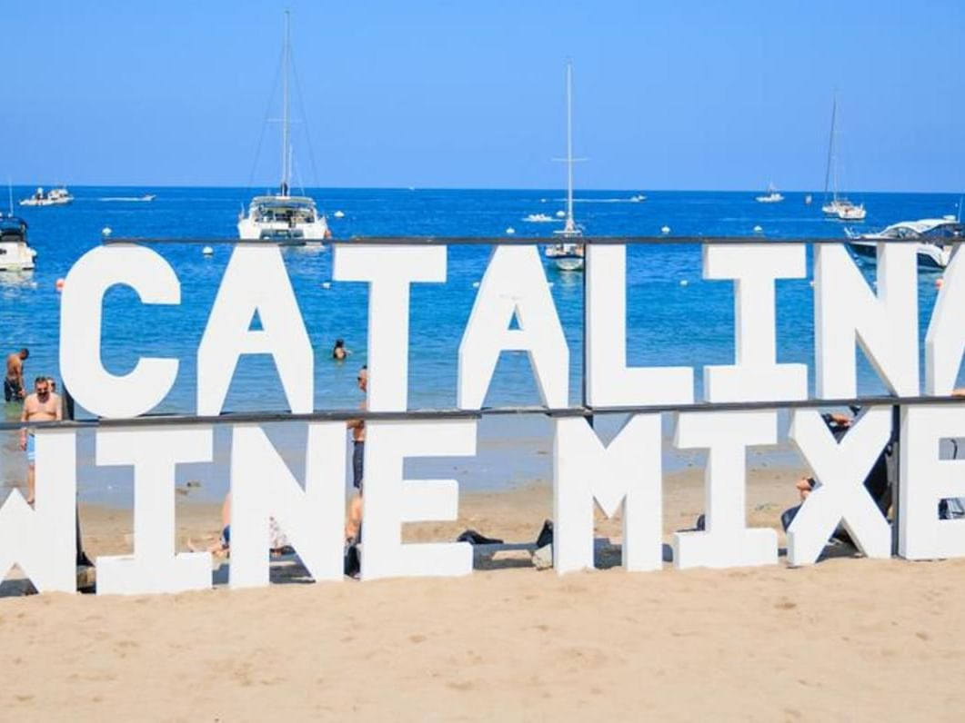 a large white sign on a beach