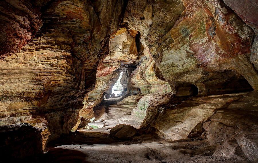 a cave with a light coming through