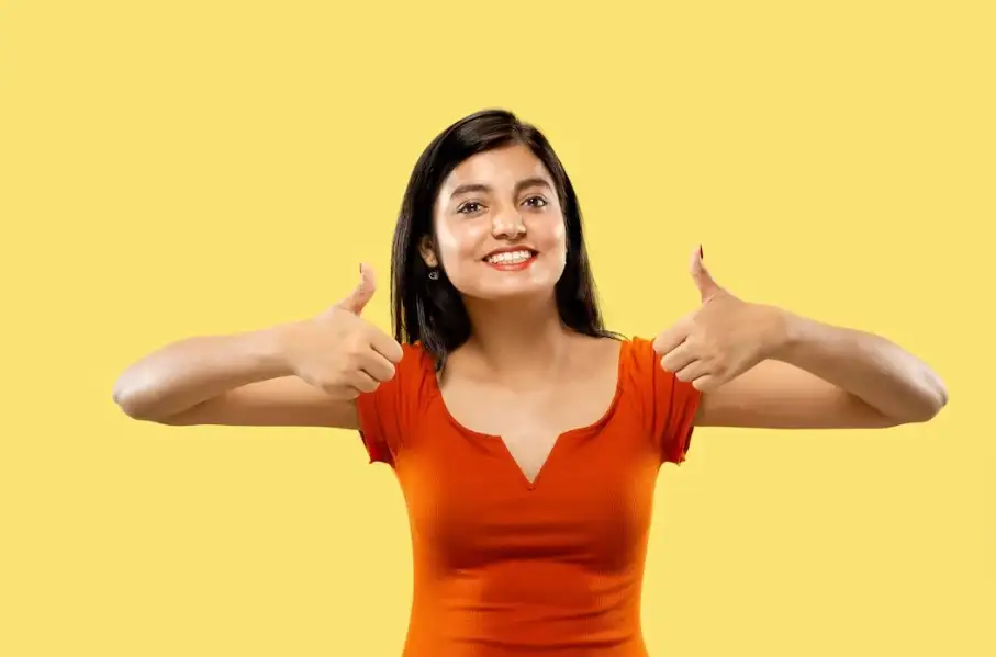a woman giving thumbs up