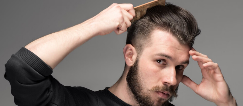 a man combing his hair