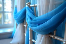 a chair with blue and white curtains