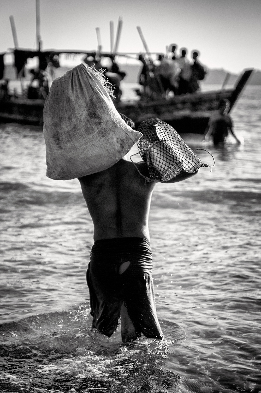 a man carrying a net on his head