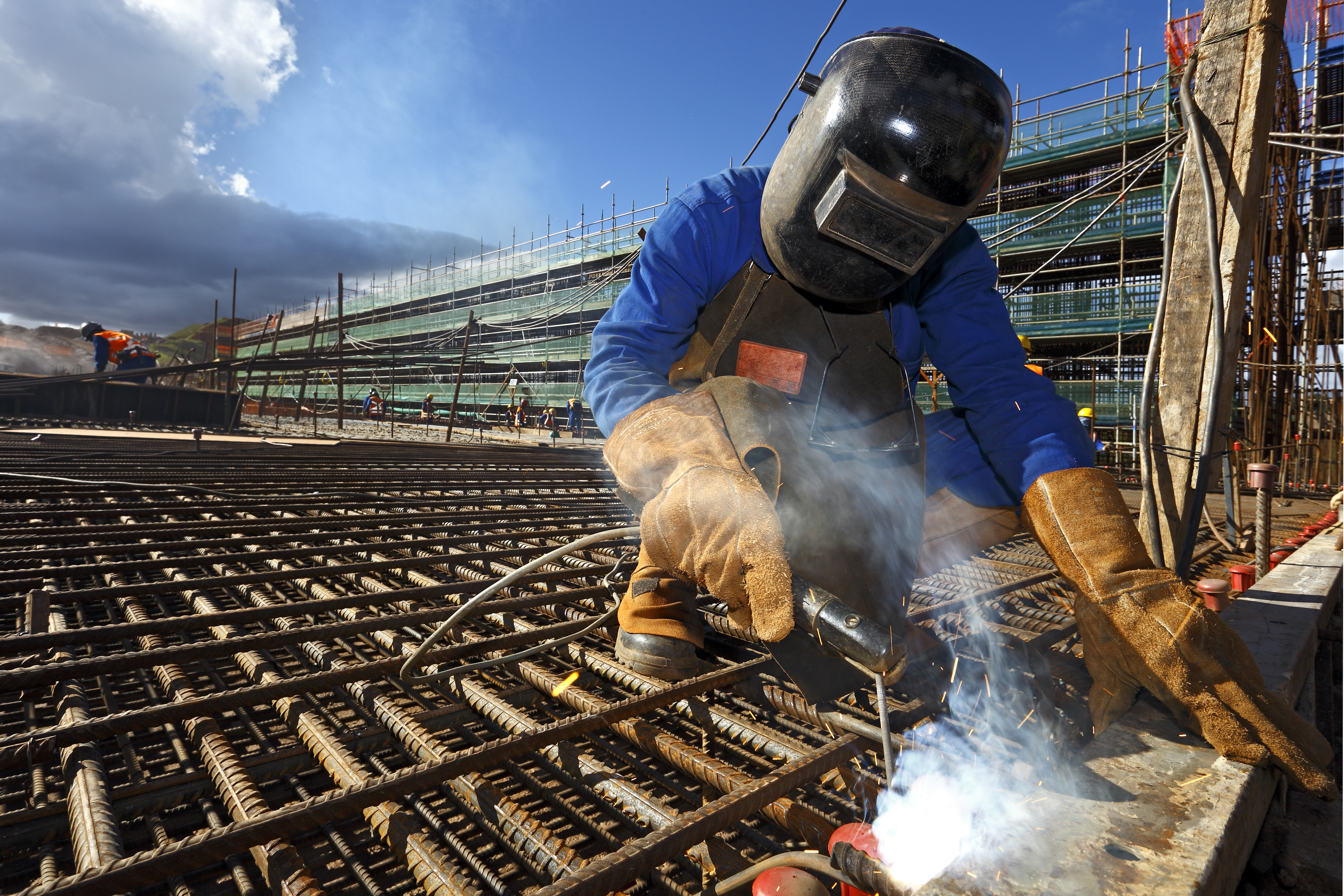 a man welding a steel structure