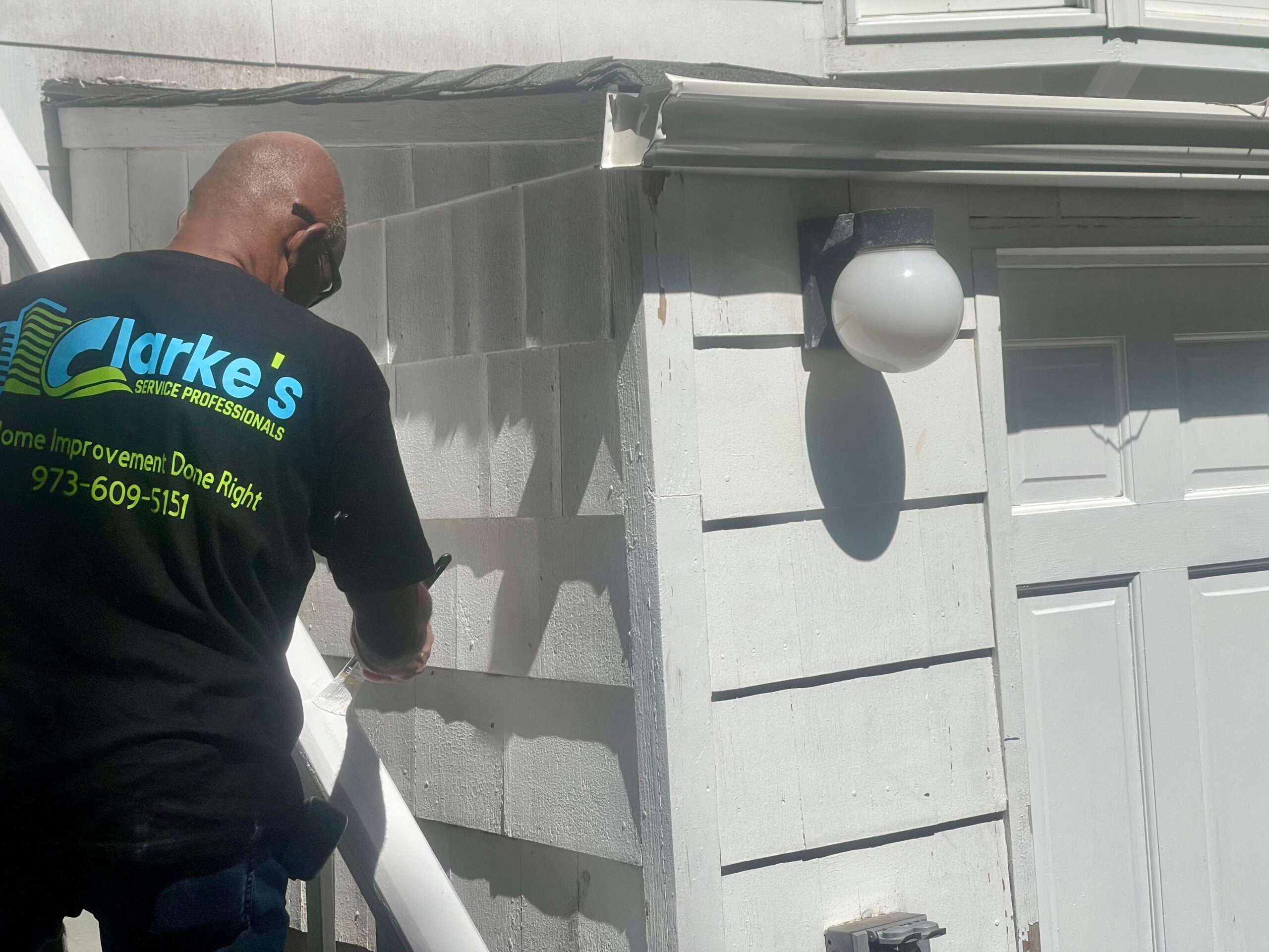 a man painting a house