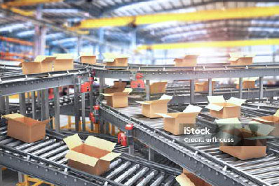 boxes on conveyor belt in a factory