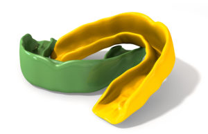 a green and yellow plastic object
