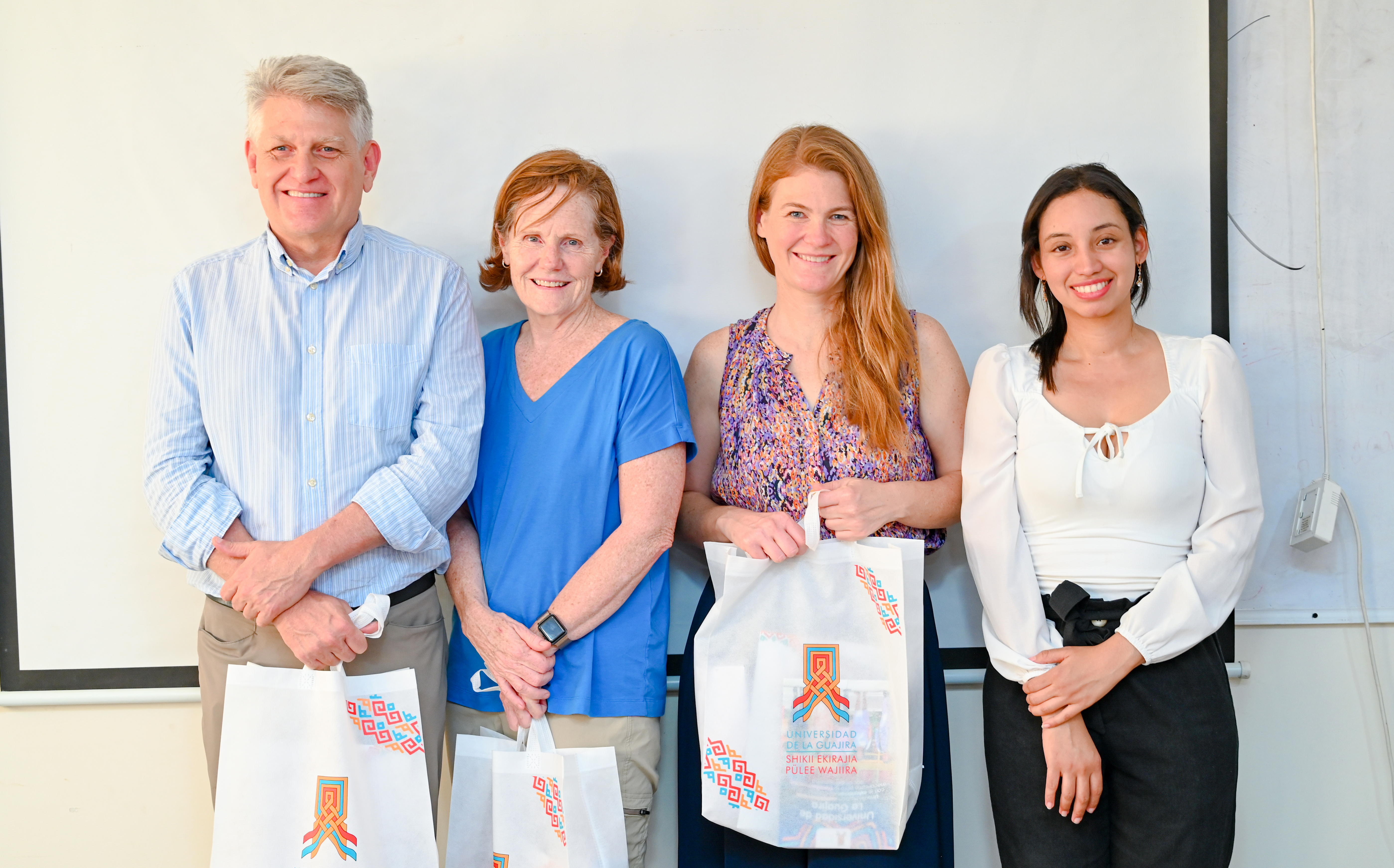 a group of people holding shopping bags