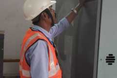 a man wearing a helmet and safety vest