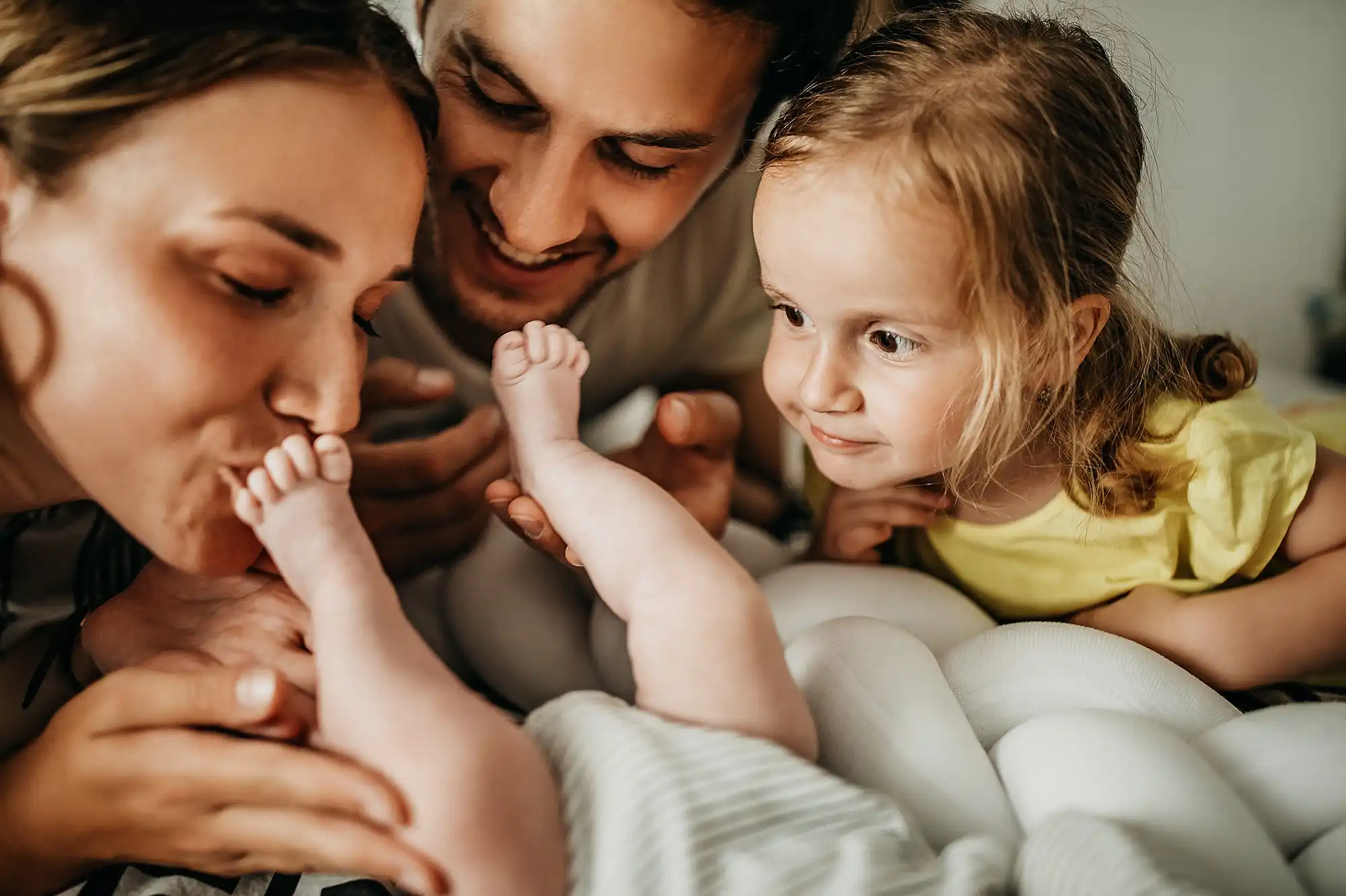 a man and woman with a baby