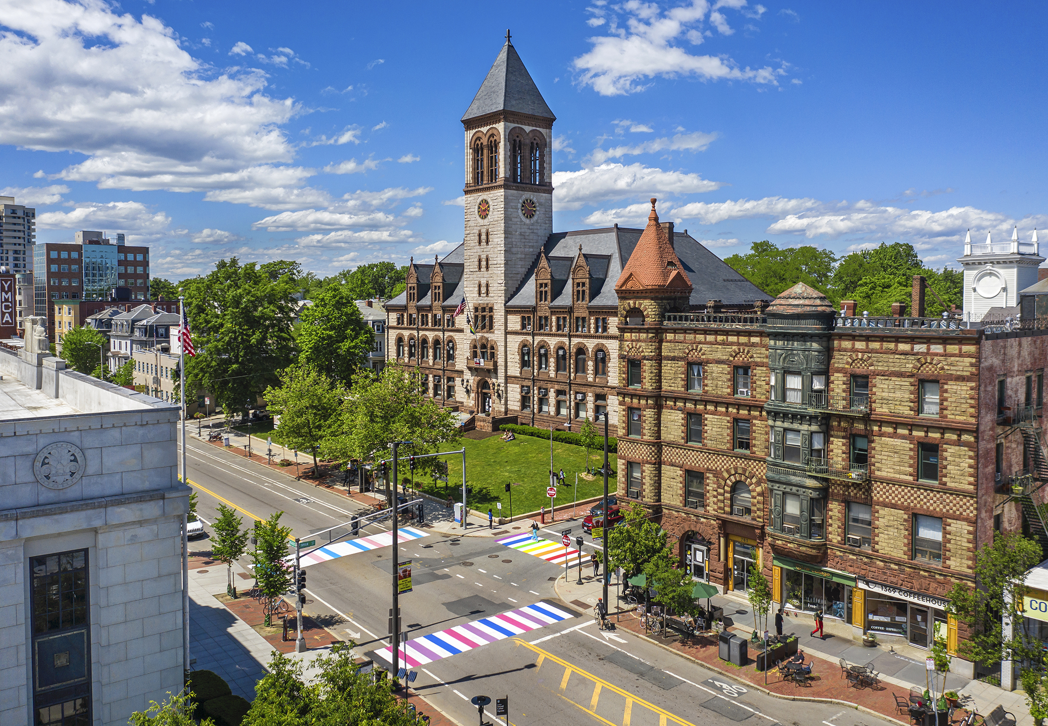 a building with a tower and a street in the background