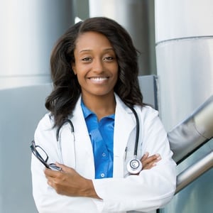 a woman wearing a white coat and stethoscope