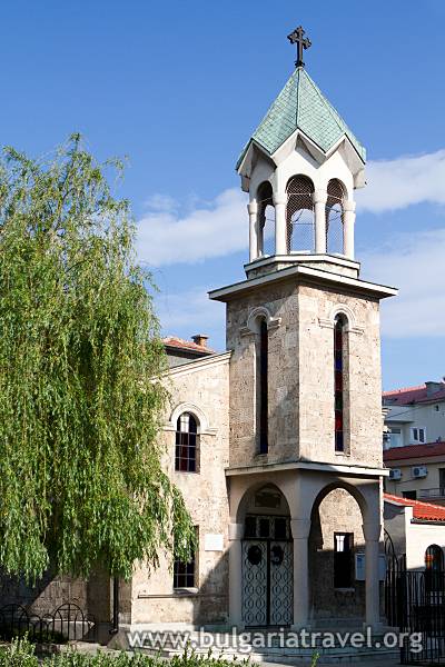 a stone building with a bell tower