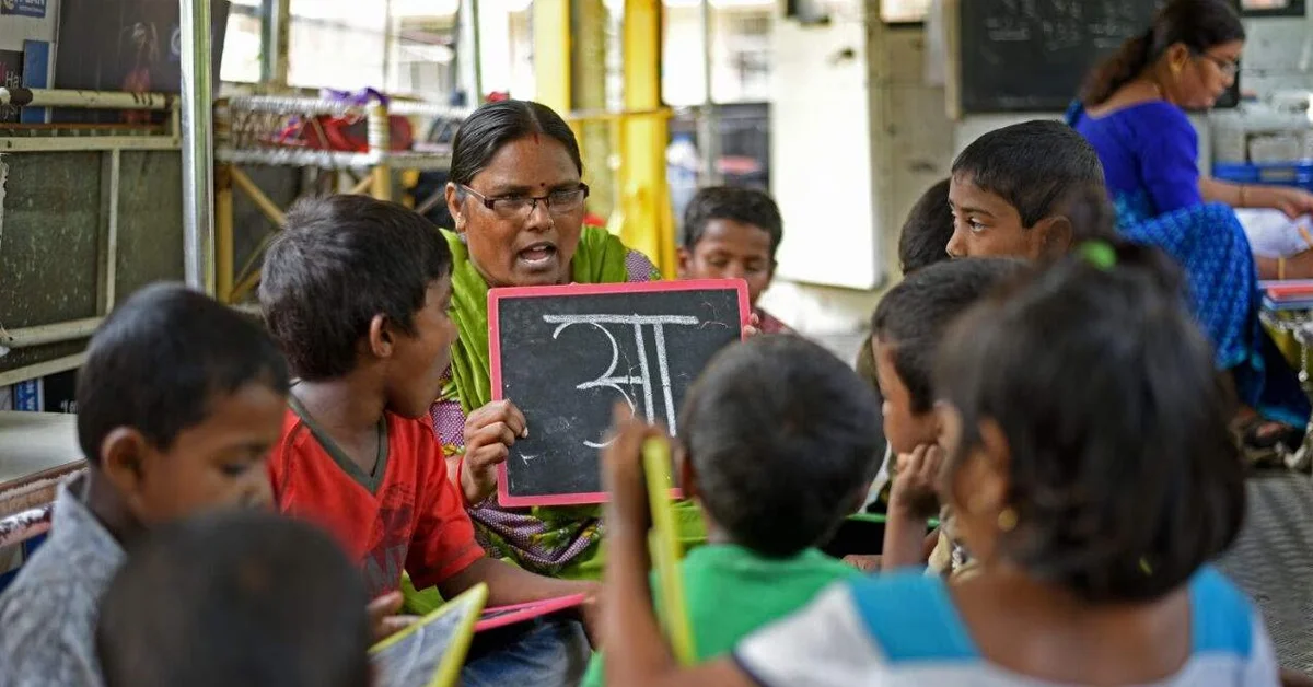 a woman teaching a group of children
