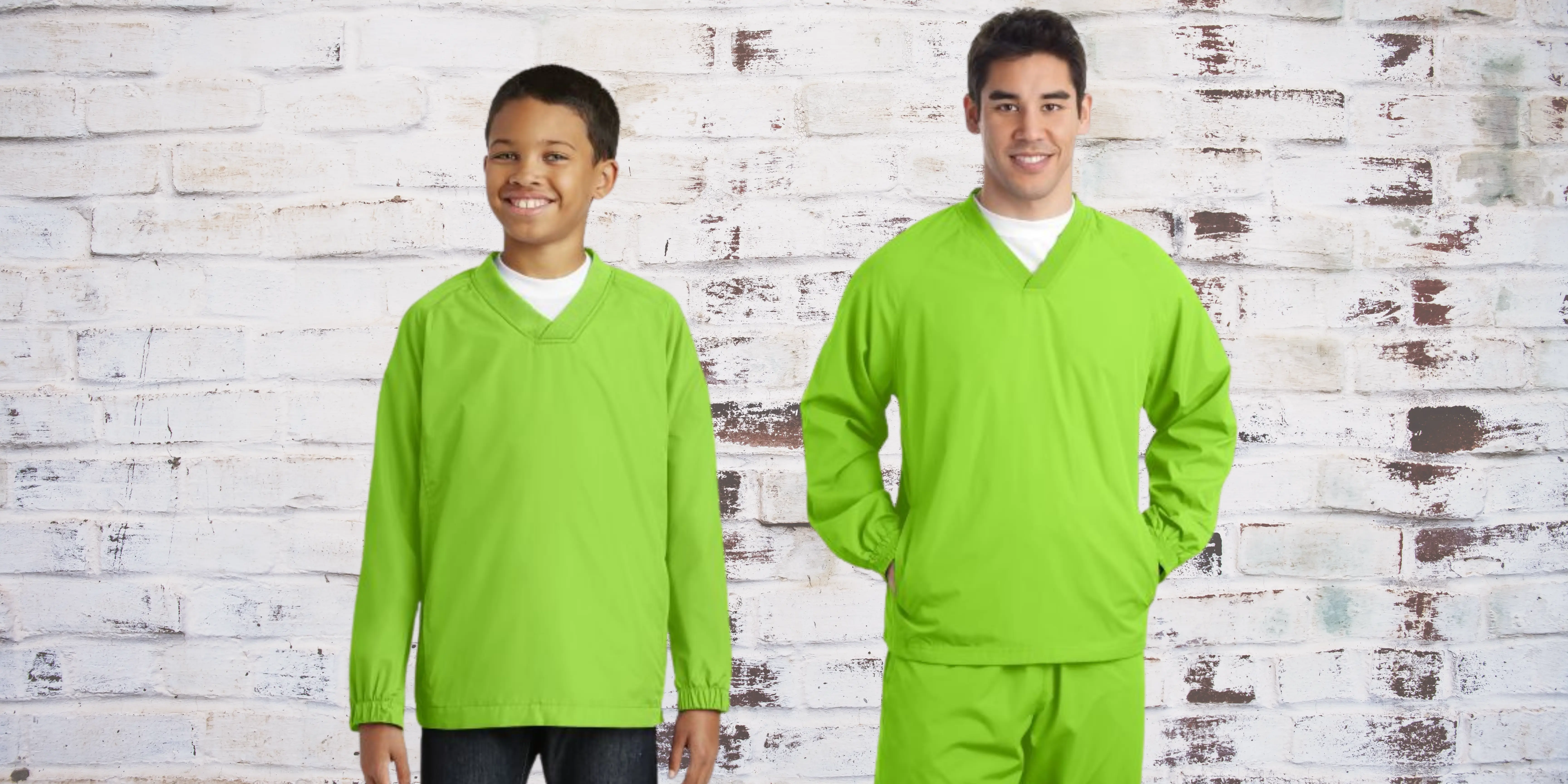 a man and boy in matching green shirts