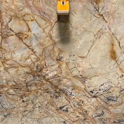 a marble surface with a yellow object on it
