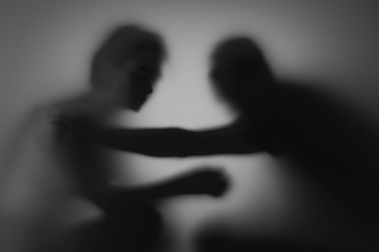 a silhouette of a person fighting