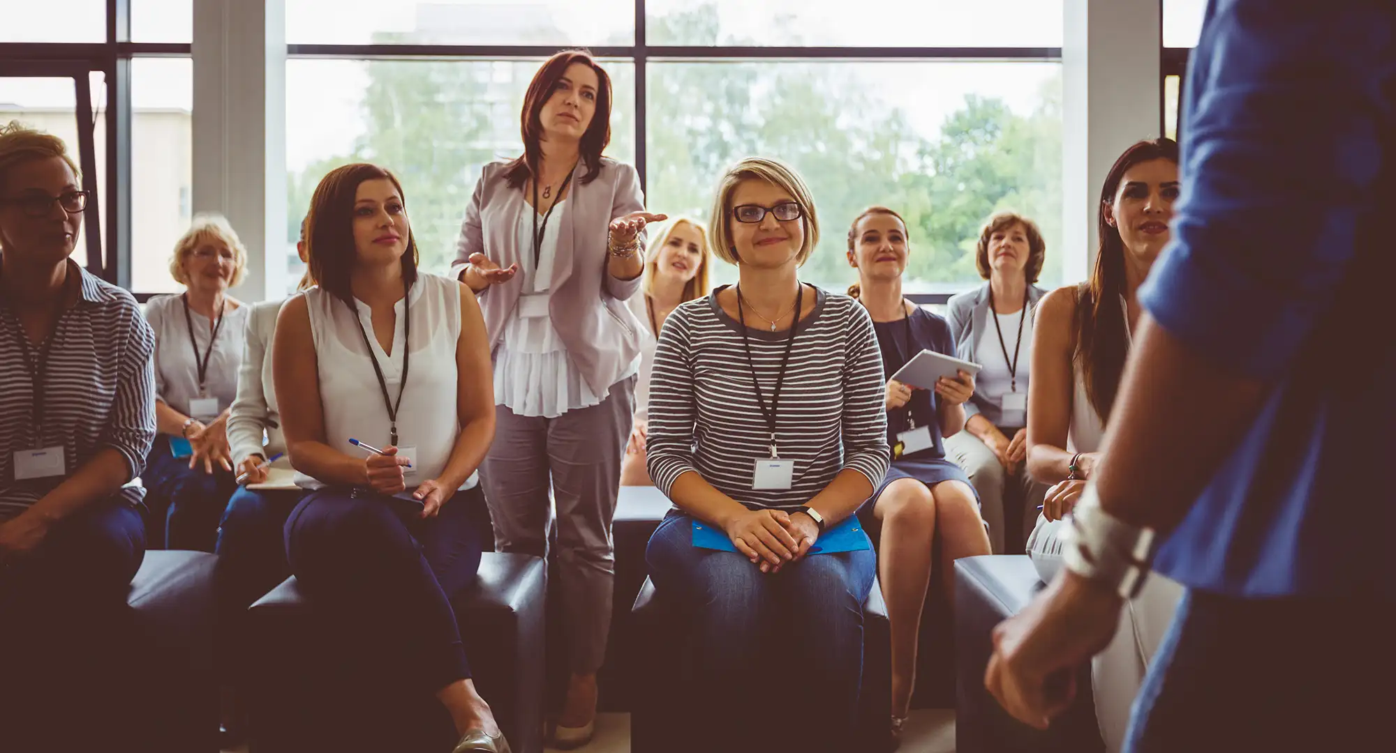 a group of women sitting in a room