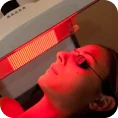 a woman getting a red light treatment