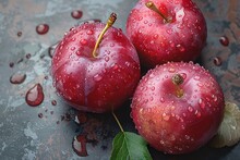 a group of red apples with water drops on them