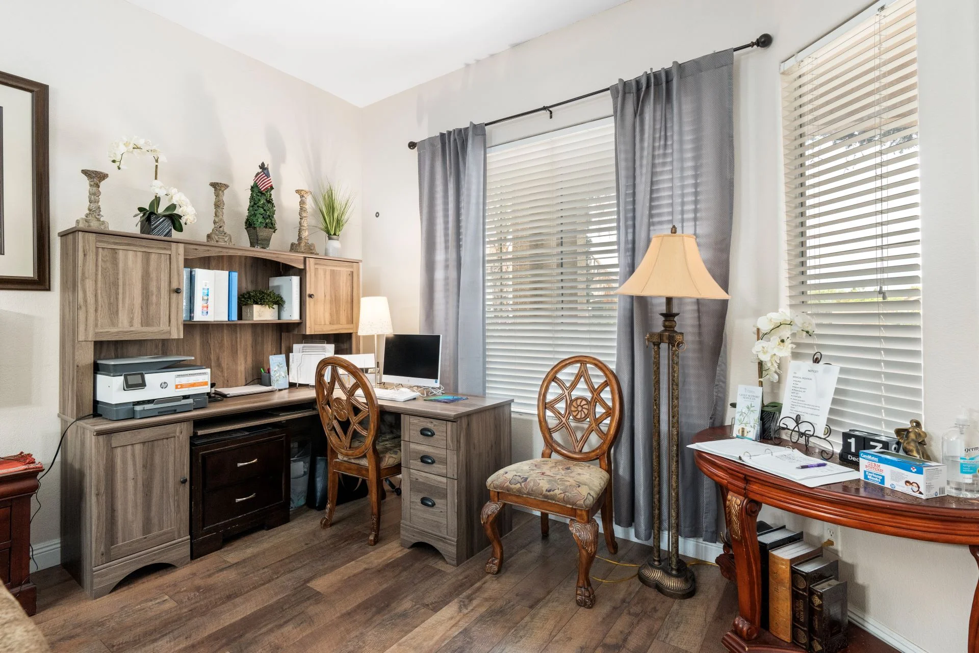 a room with a desk and a lamp