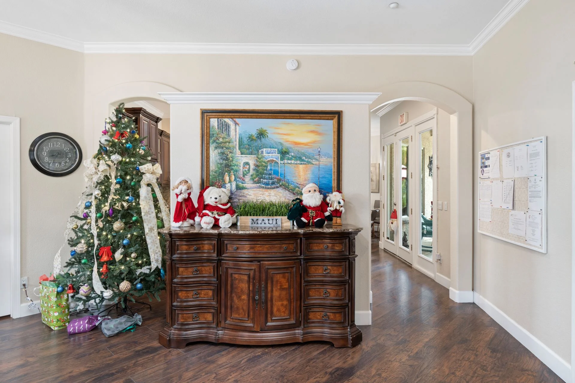 a christmas tree and a dresser in a house