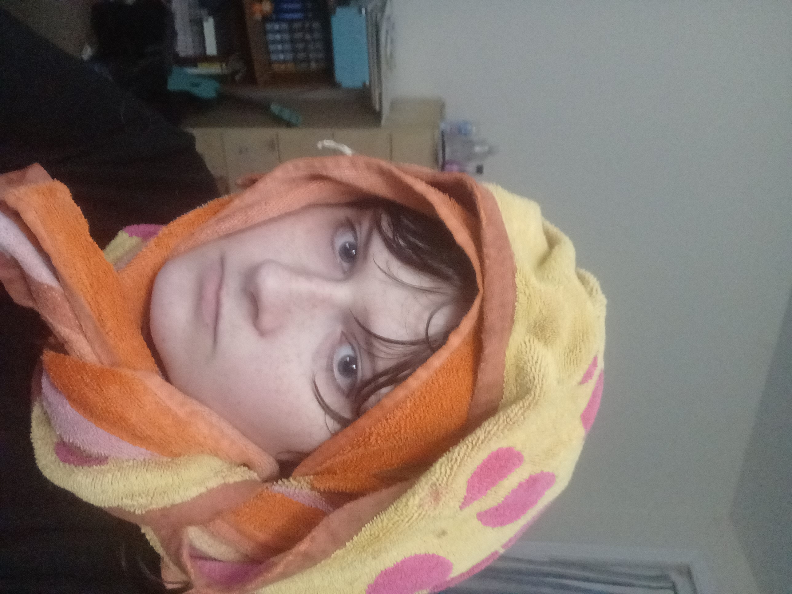 a person with a towel on their head