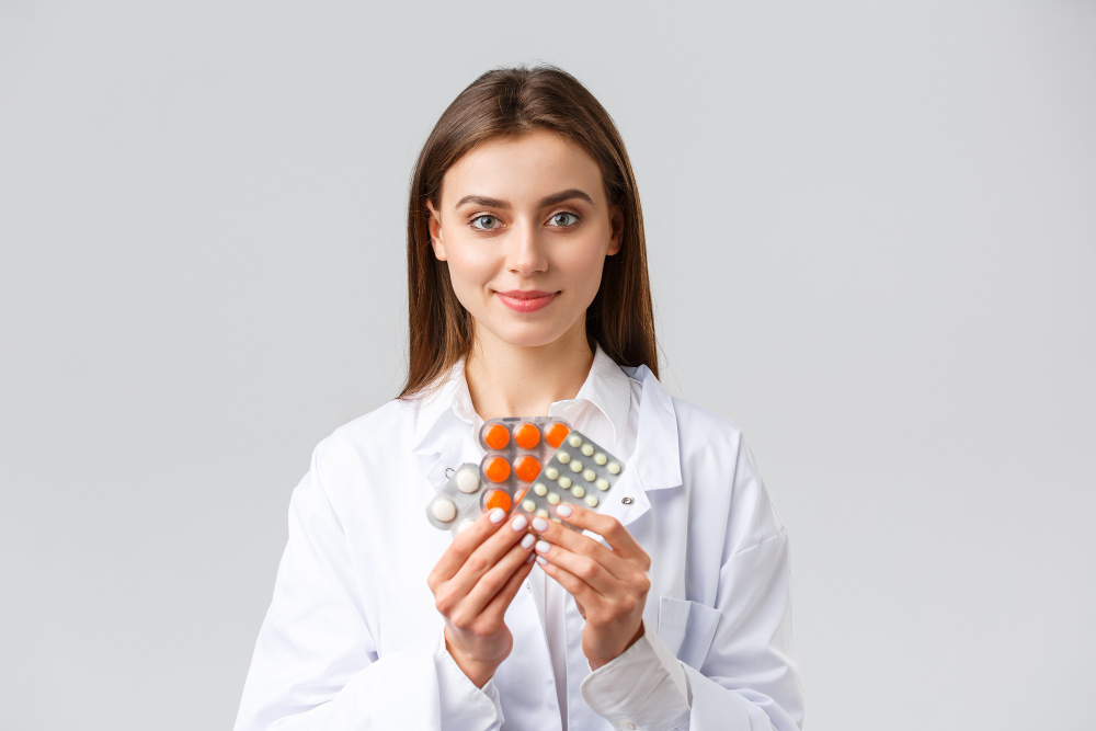 a woman holding pills in her hands