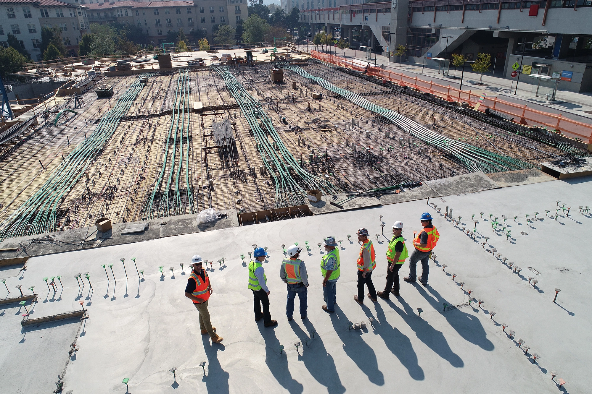 a group of men standing on a roof