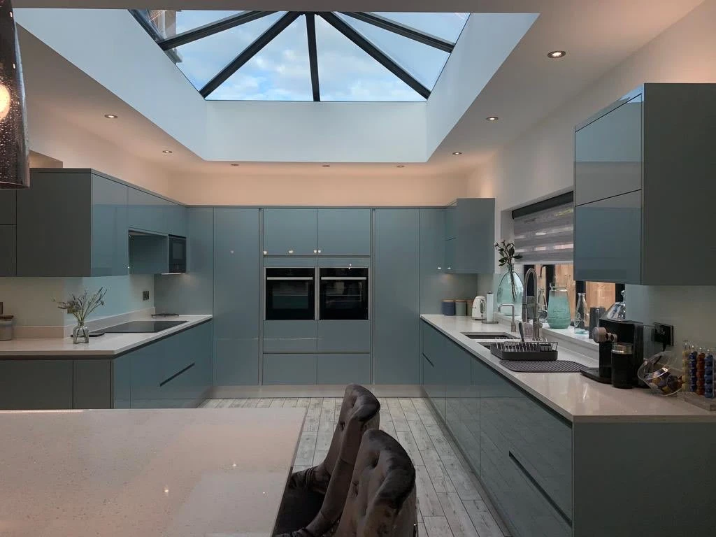 a kitchen with skylight and a large island