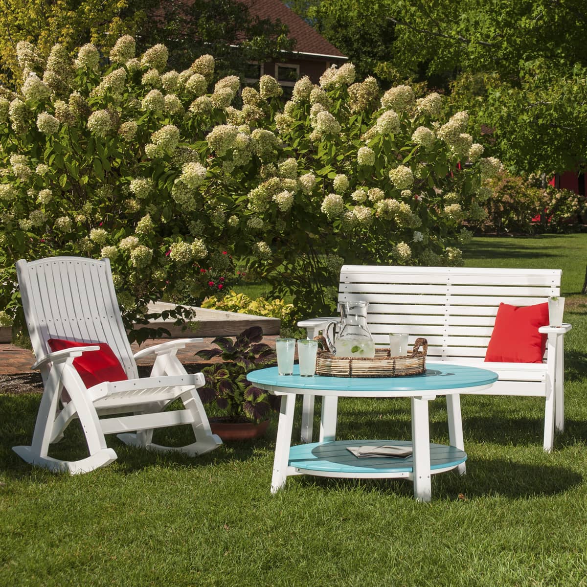 a lawn chair and table in a yard