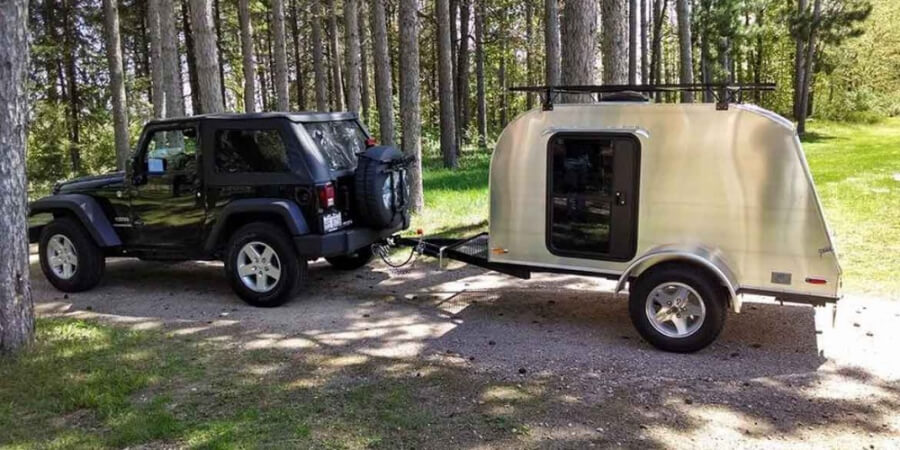 a car with a trailer attached to it